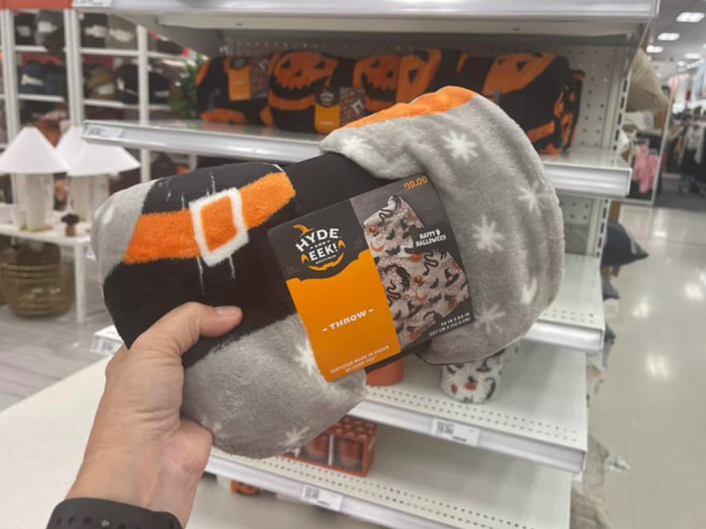 hand holding halloween blankets