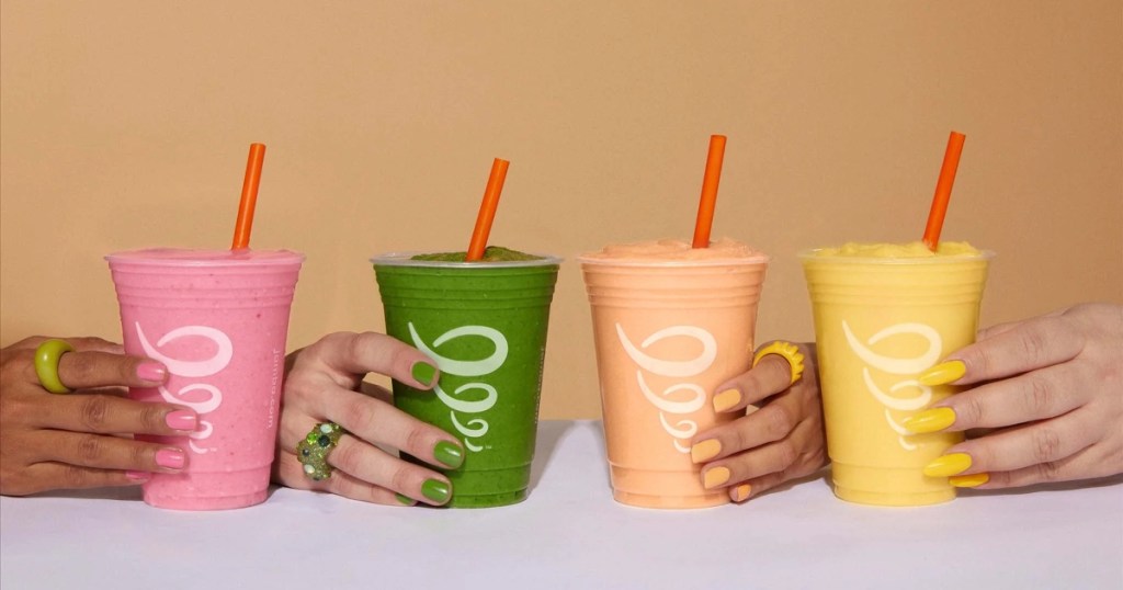 four hands holding smoothies from Jamba