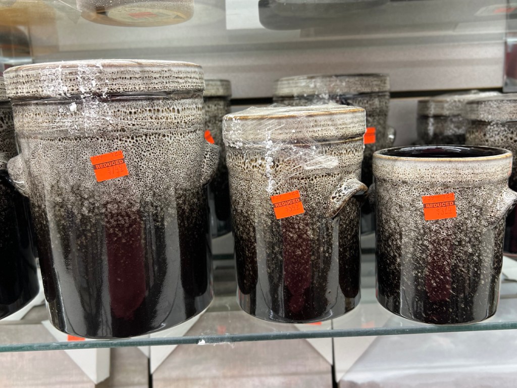 ceramic jars on shelf