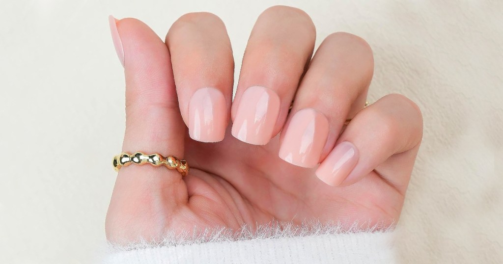 hand with light pink nails 