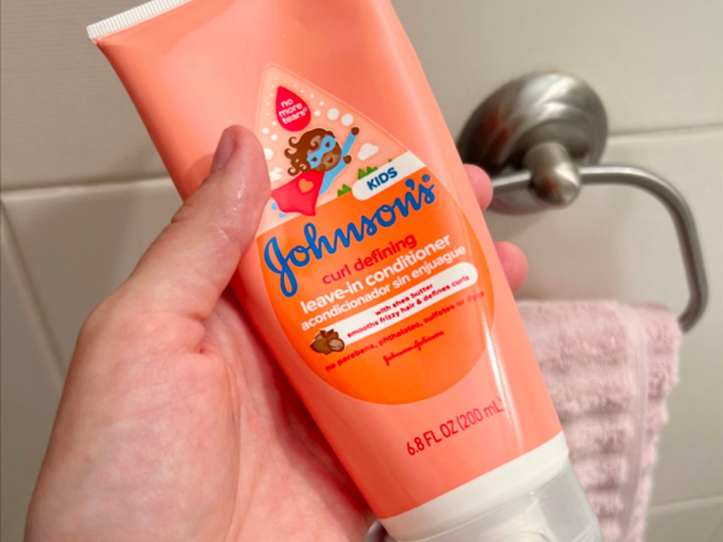 hand holding johnsons curl defining conditioner 