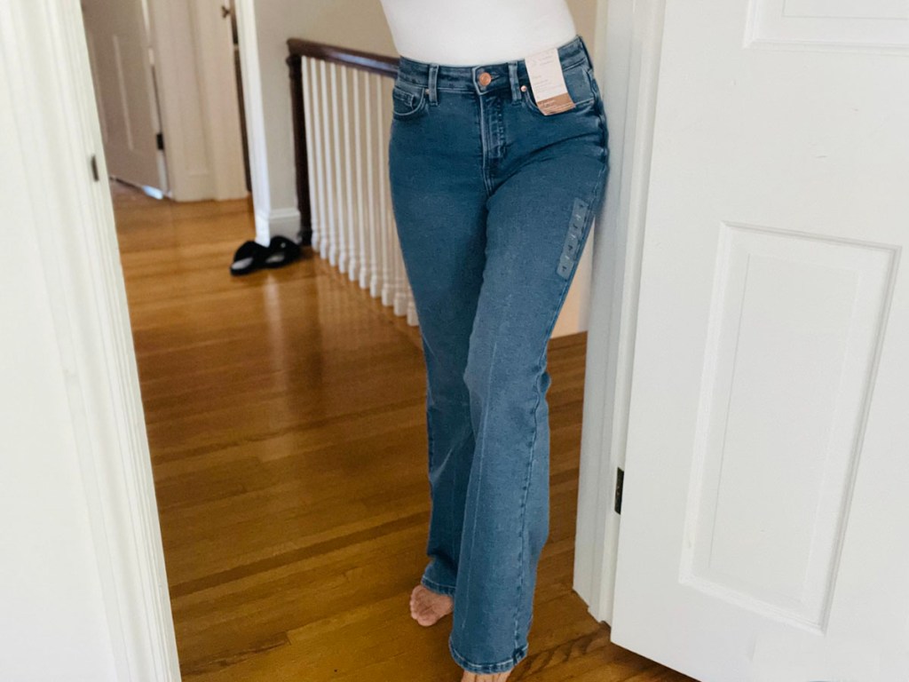 woman wearing white tee and blue jeans
