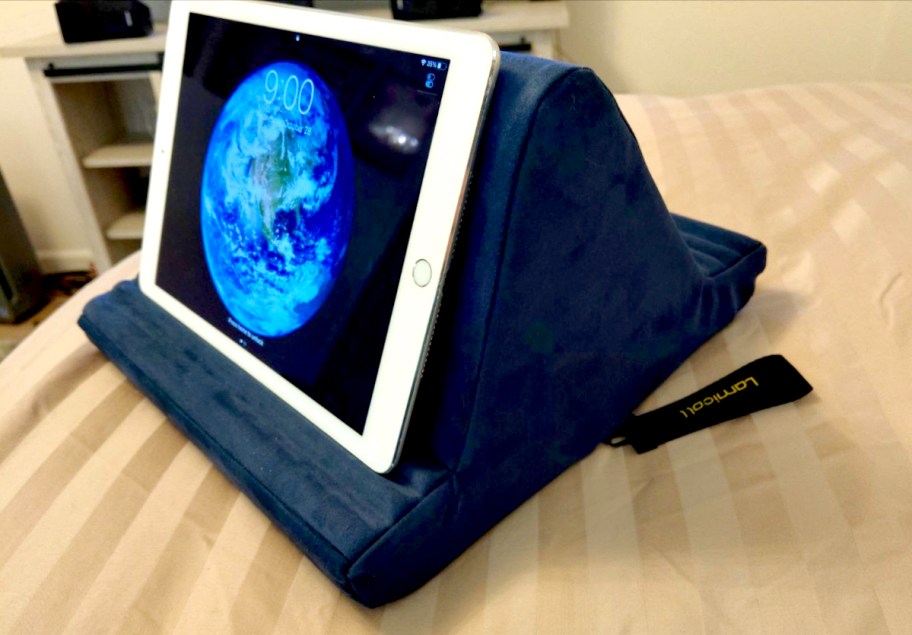 pillow stand on bed with ipad leaning on front