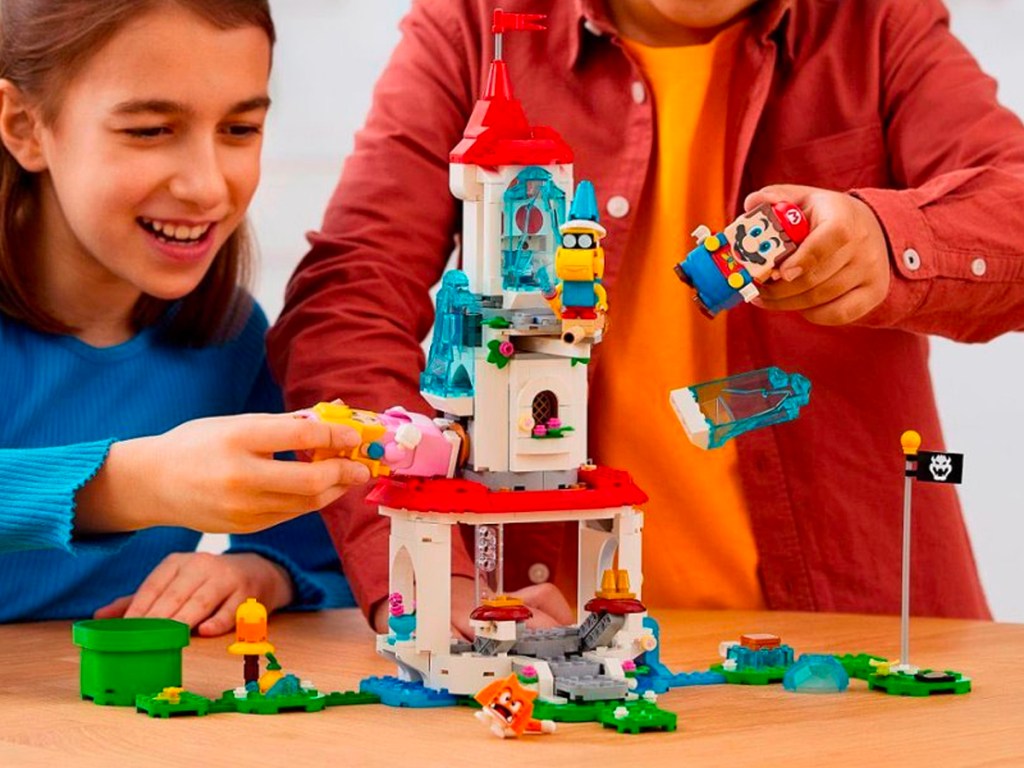 kids playing with lego super mario set
