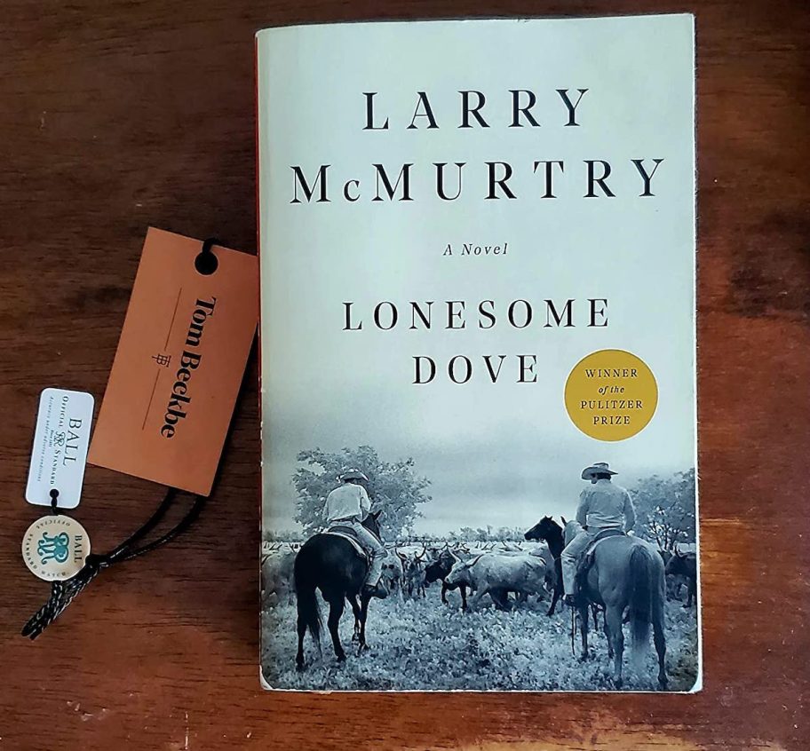 lonesome dove book on wood table