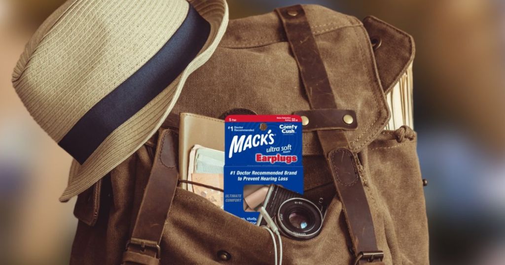 A backpack with a pack of mack's Earplugs sticking out of the pocket