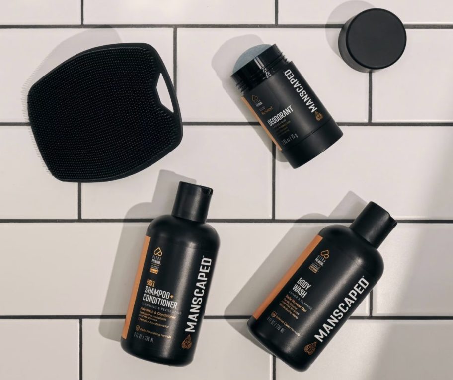 mens body care products on subway tile