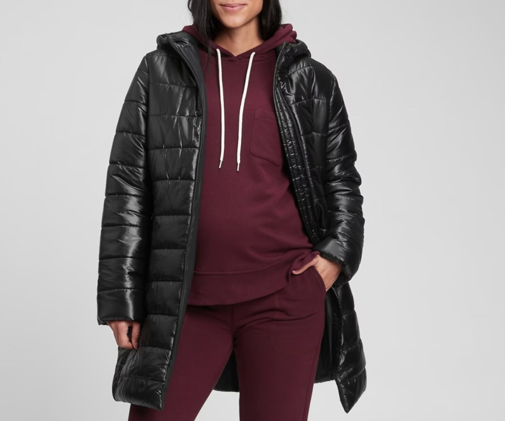 black puffer jacket over maroon sweatsuit