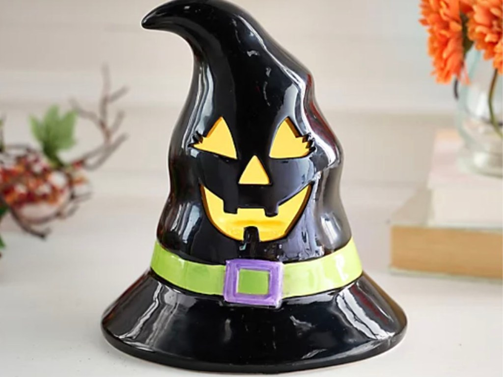 black ceramic witch hat on table