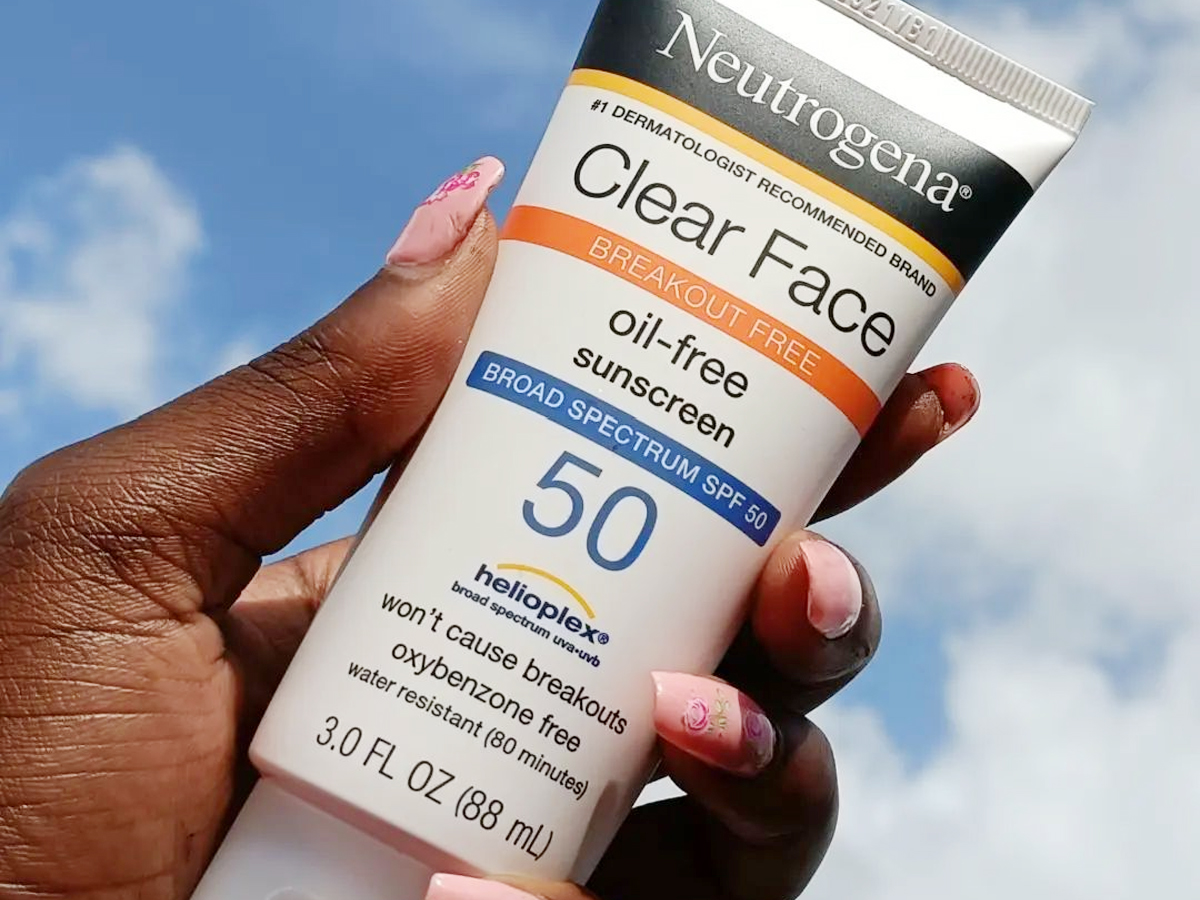 hand holding neutrogena spf 50 sunscreen 