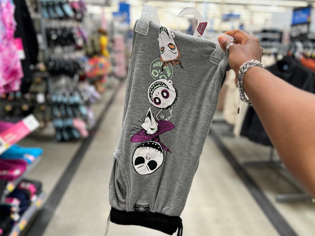 hand holding nightmare before christmas pants