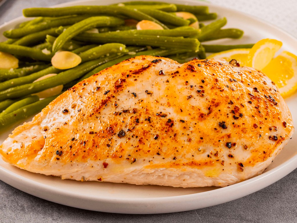perdue boneless chicken on plate with green beans