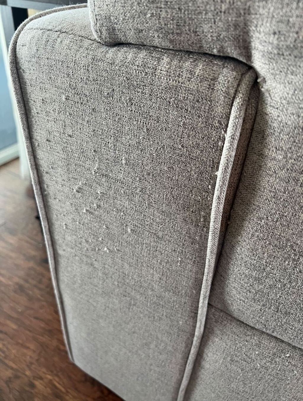 close up of piled gray couch