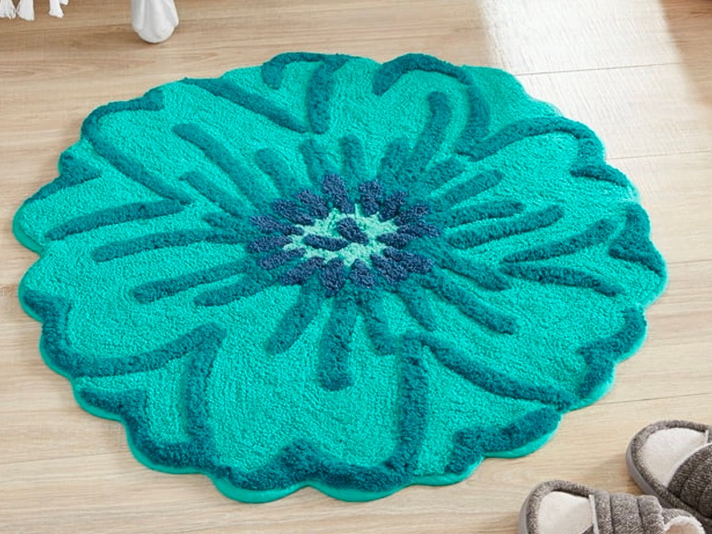 round flower teal bath rug in bathroom 