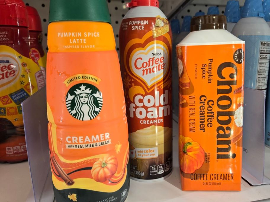 starbucks, coffeemate, and chobani pumpkin spice creamers on shelf in store
