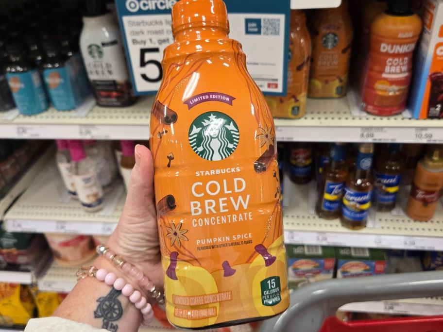 Starbucks Pumpkin Spice Cold Brew Concentrate bottle in hand in store
