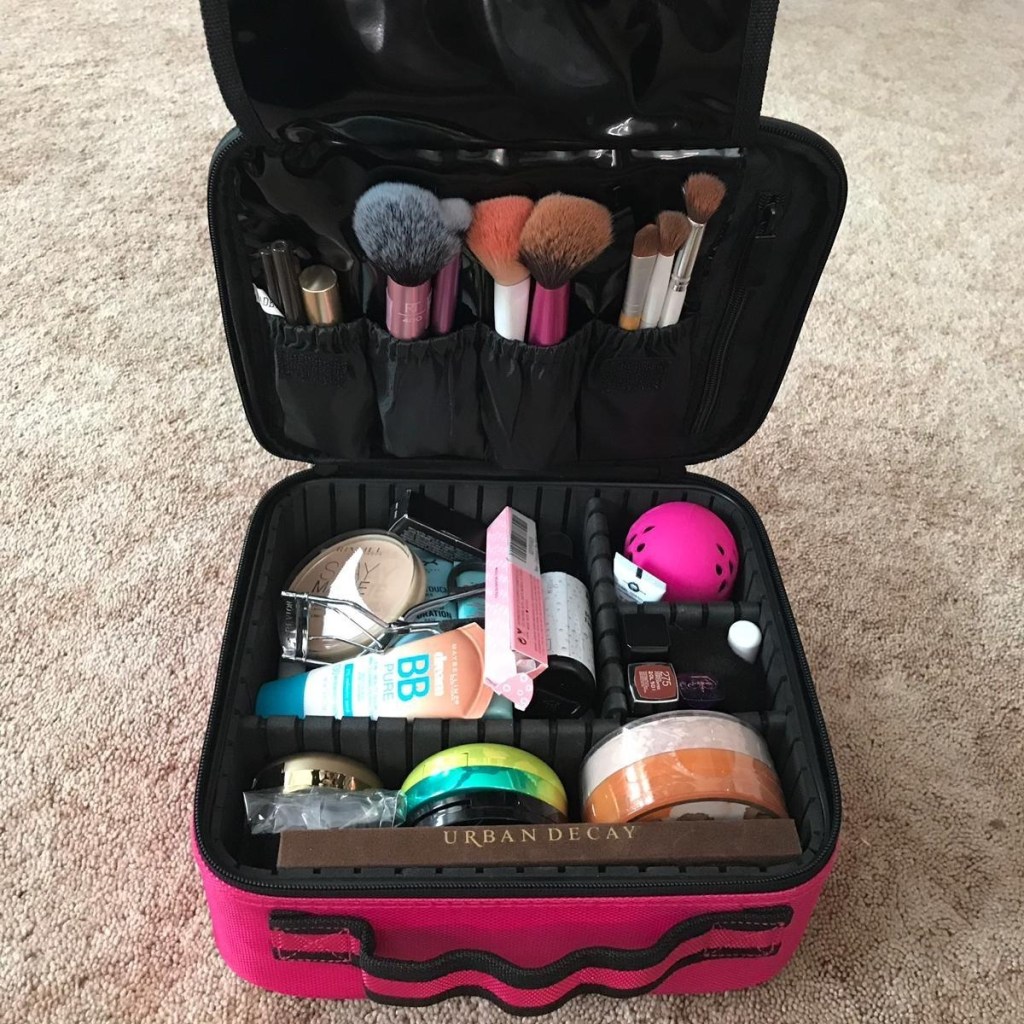 pink cosmetics case open to show contents inside