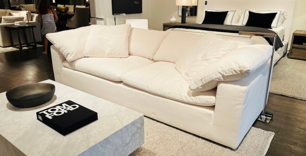white cloud couch sitting in styled room in retail store