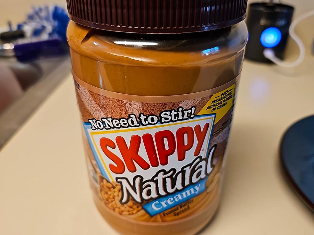 skippy natural peanut butter on counter