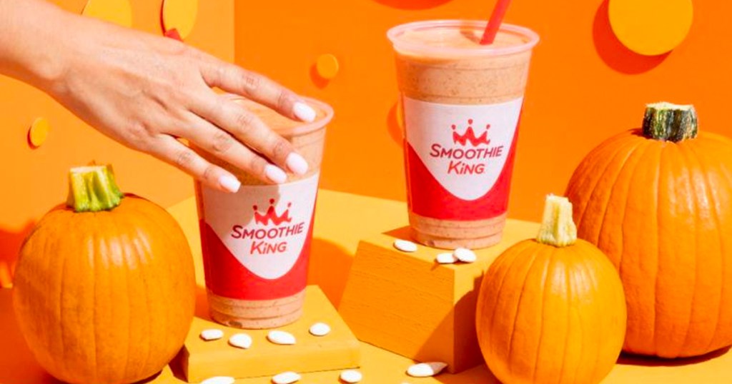 hand reaching for pumpkin smoothie