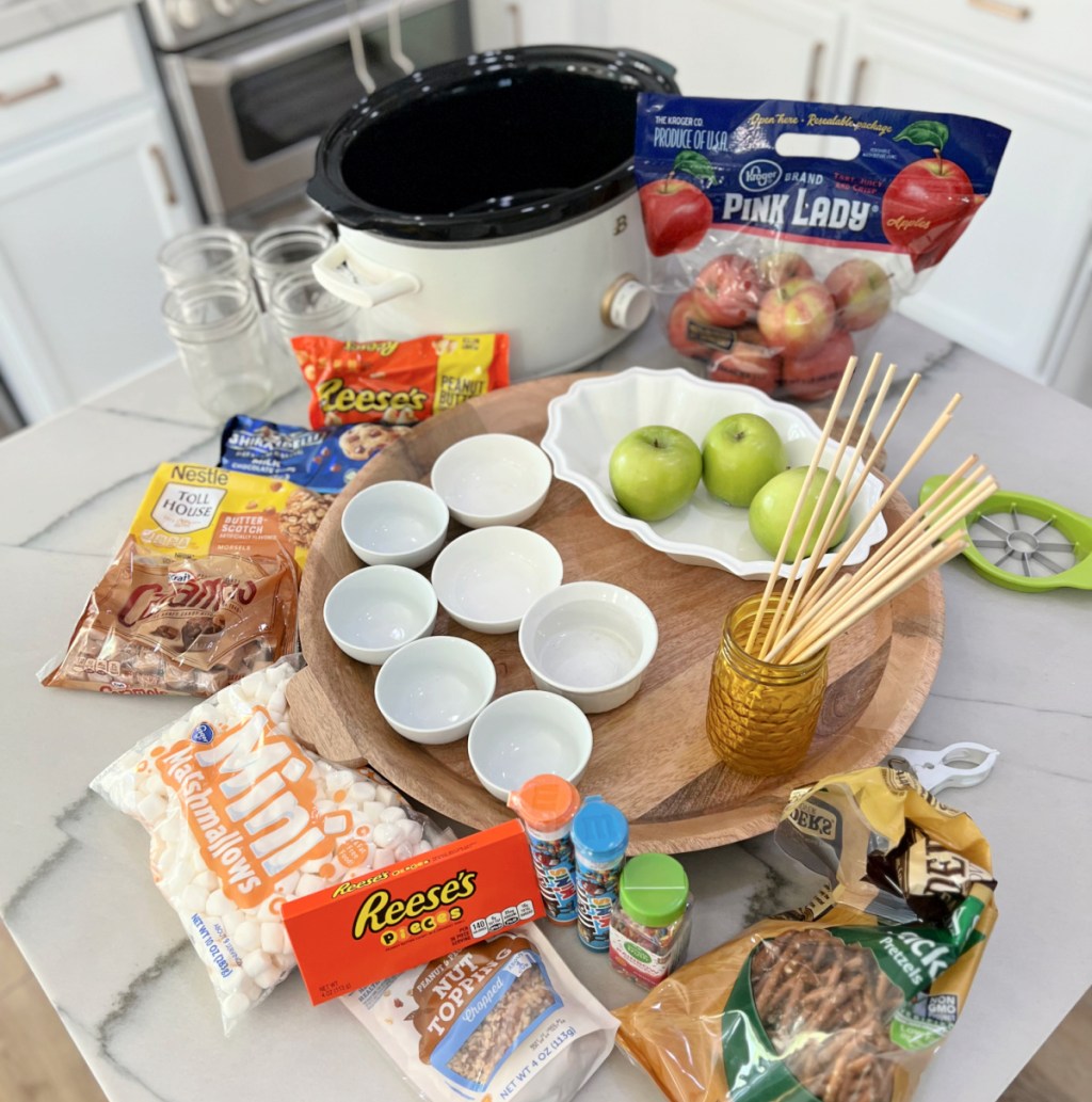 supplies for making caramel apple in a slow cooker