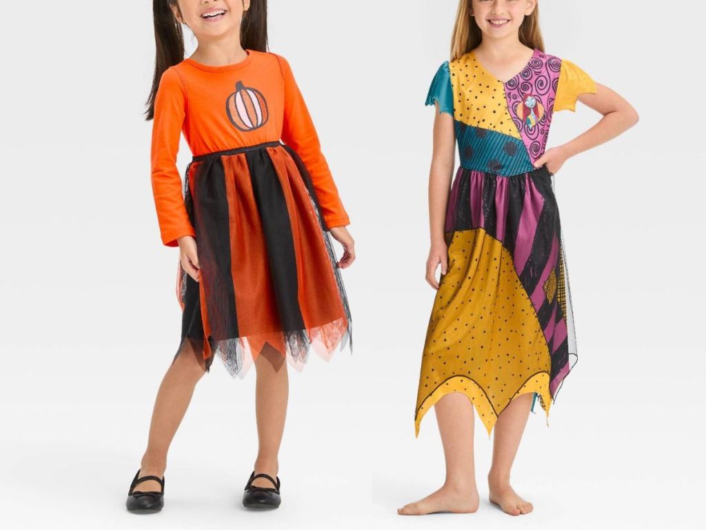 girl wearing halloween pumpkin dress and girl wearing nightmare before christmas sally costume