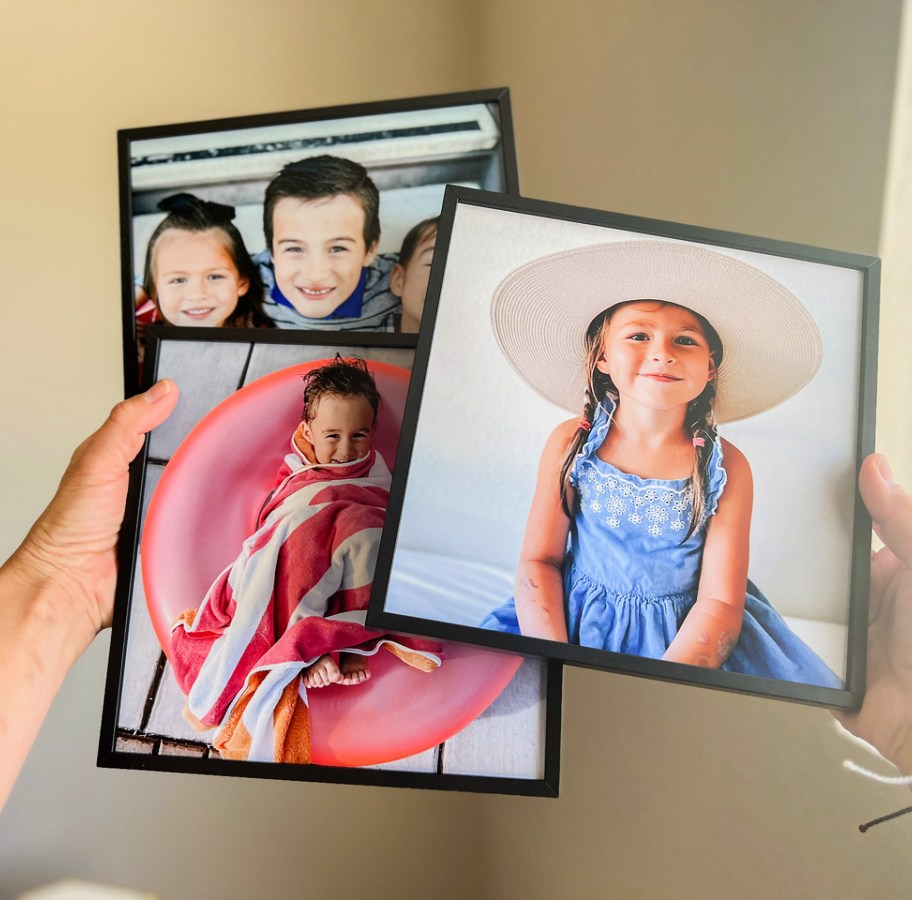 woman holding tilepix featuring images of children
