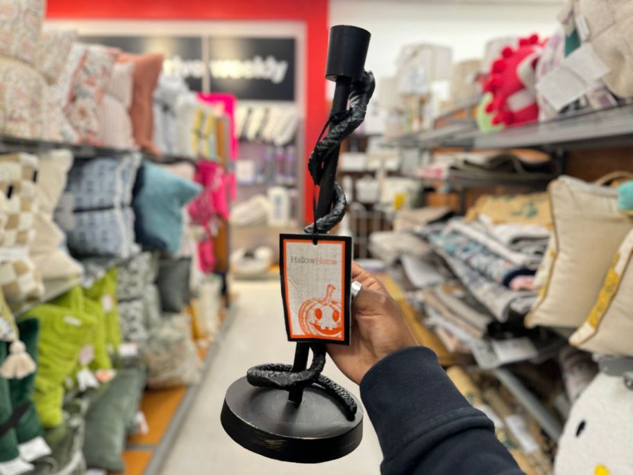 Halloween Taper Candle Holder being held by hand in store