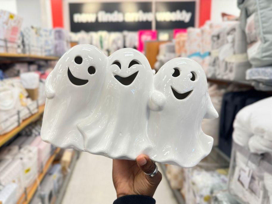 cermanic ghosts being held by hand in store