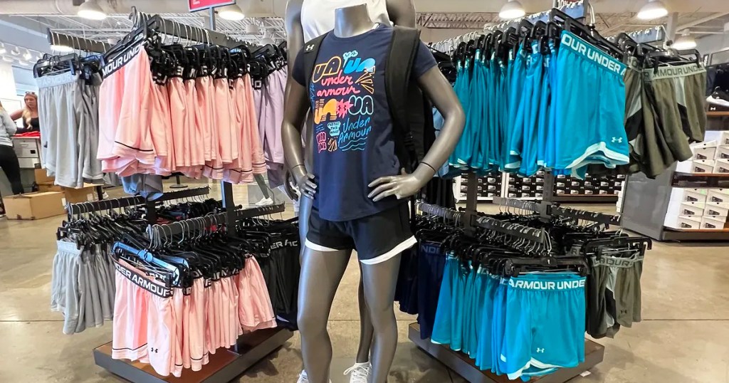 under armour mannequin wearing tee and shorts