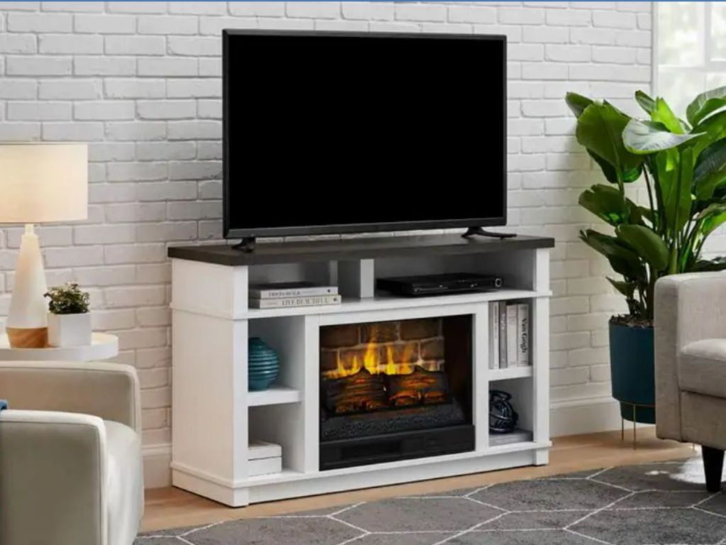 white electric fireplace TV console in living room