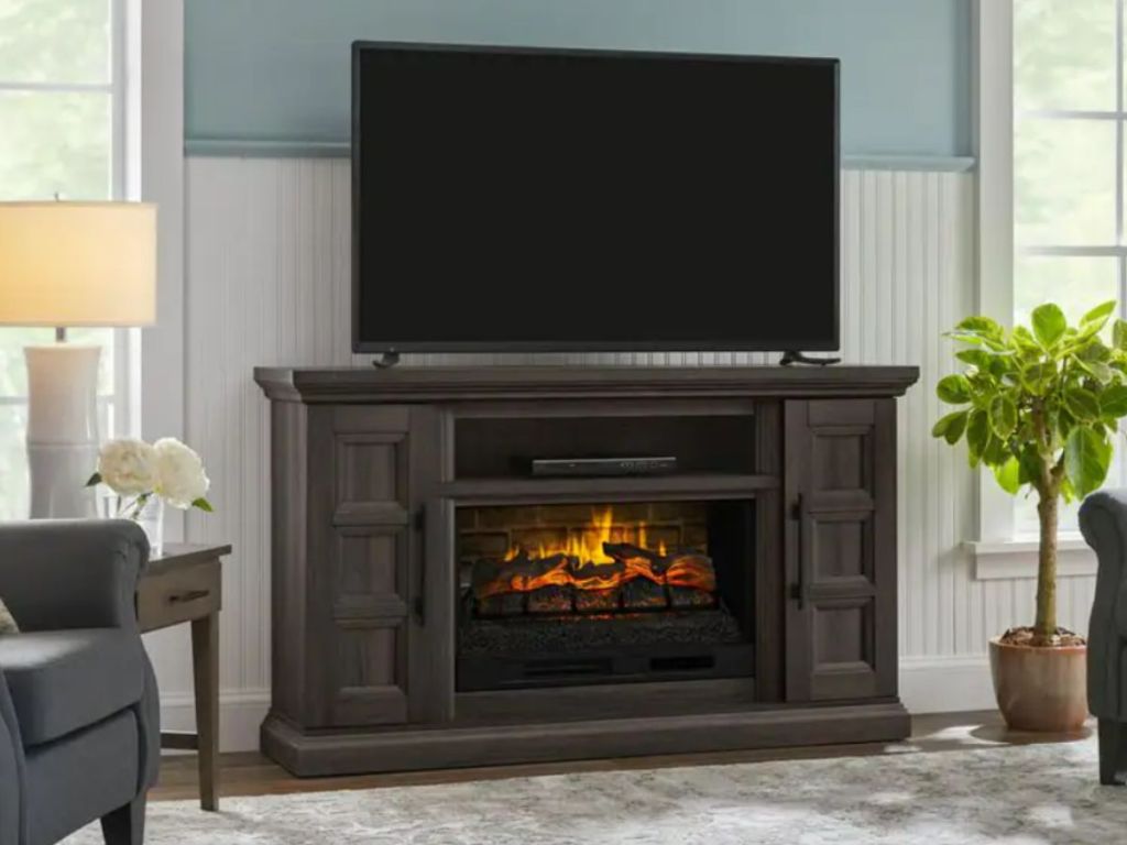 dark brown electric fireplace TV console in living room