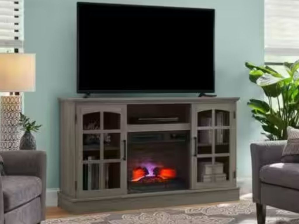 medium brown electric fireplace TV console in living room