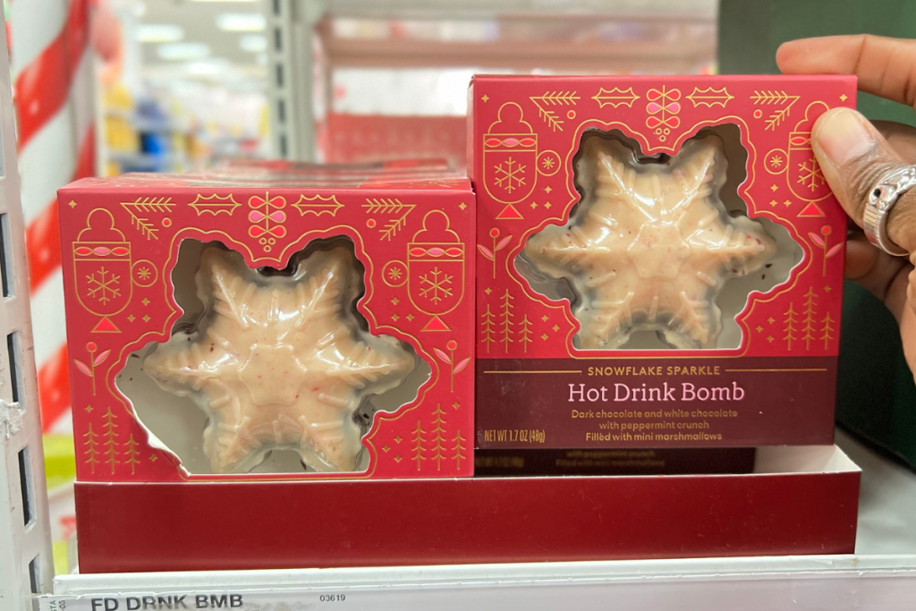 hand holding Snowflake Sparkle Hot Cocoa Bomb in Target store