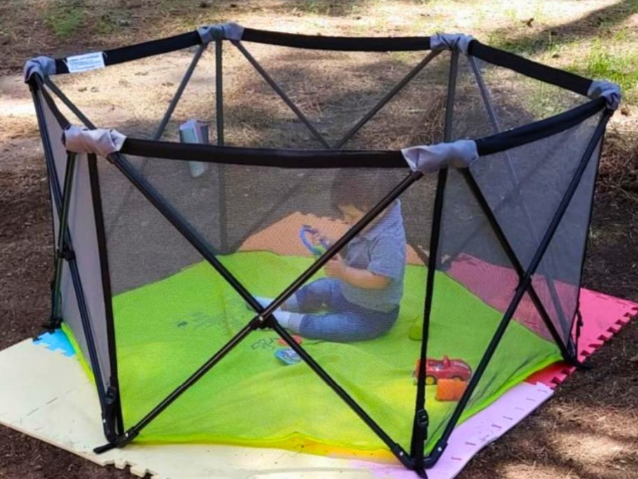 pay in a pop up playard playpen outside in the shade