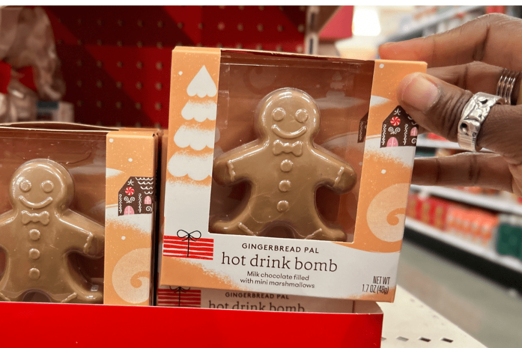 hand holding a package of Gingerbread Man Hot Cocoa Bomb in Target store