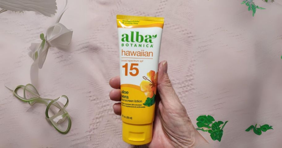 Alba Botanica Sunscreen 3oz Bottle in hand