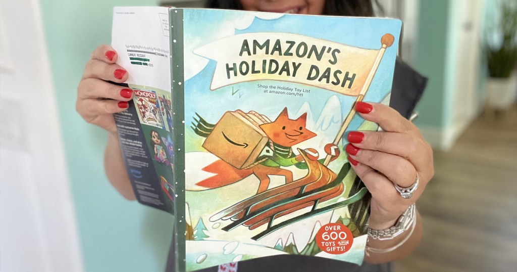 woman holding up Amazon Holiday Toy Catalog Book