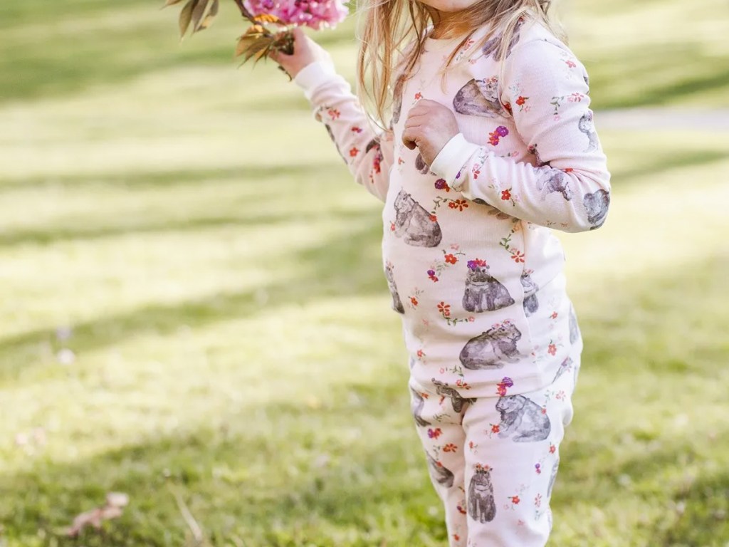 girl in pink hippo print pajamas