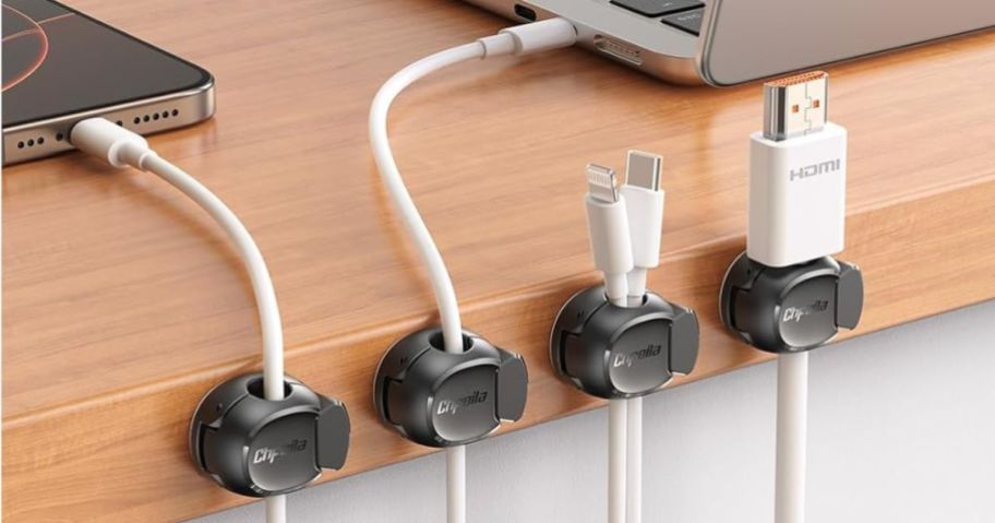 A desk with 4 cord clips