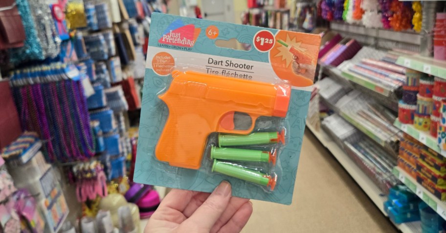 a Dart shooter, one of our Dollar Tree Elf on the Shelf ideas