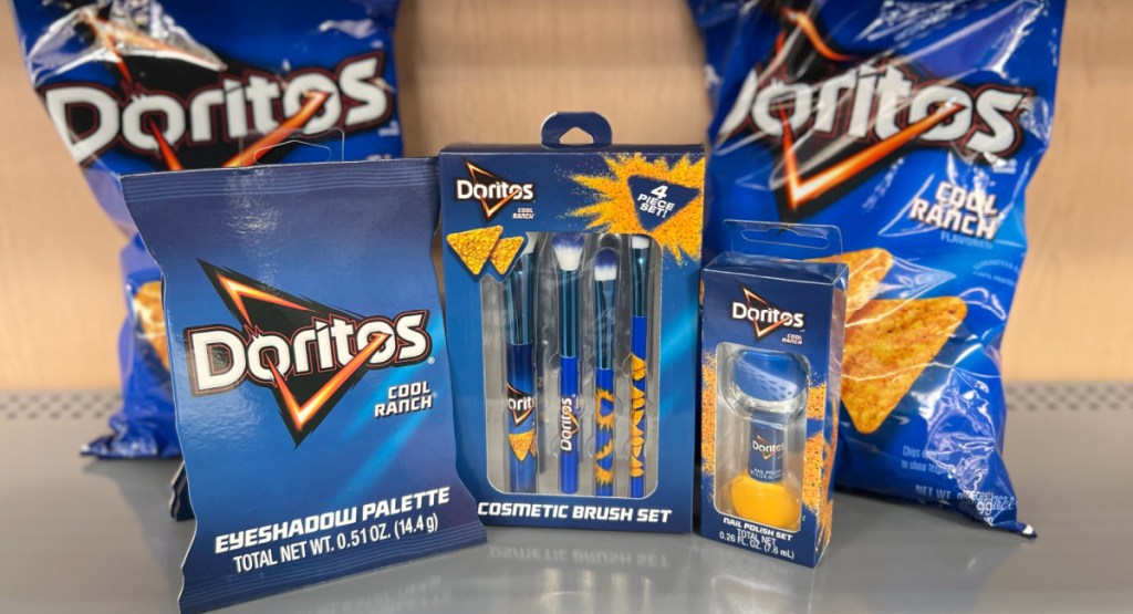Doritos makeup collection with two bags of Doritos in the background