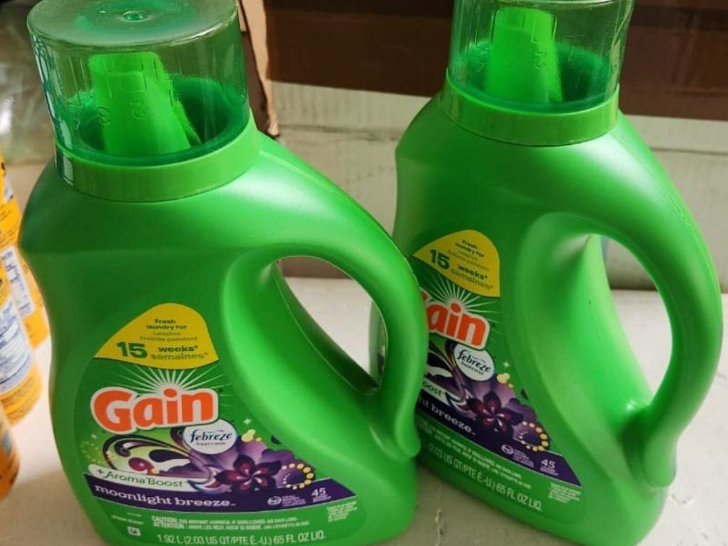 two bottles of Gain moonlight breeze detergent