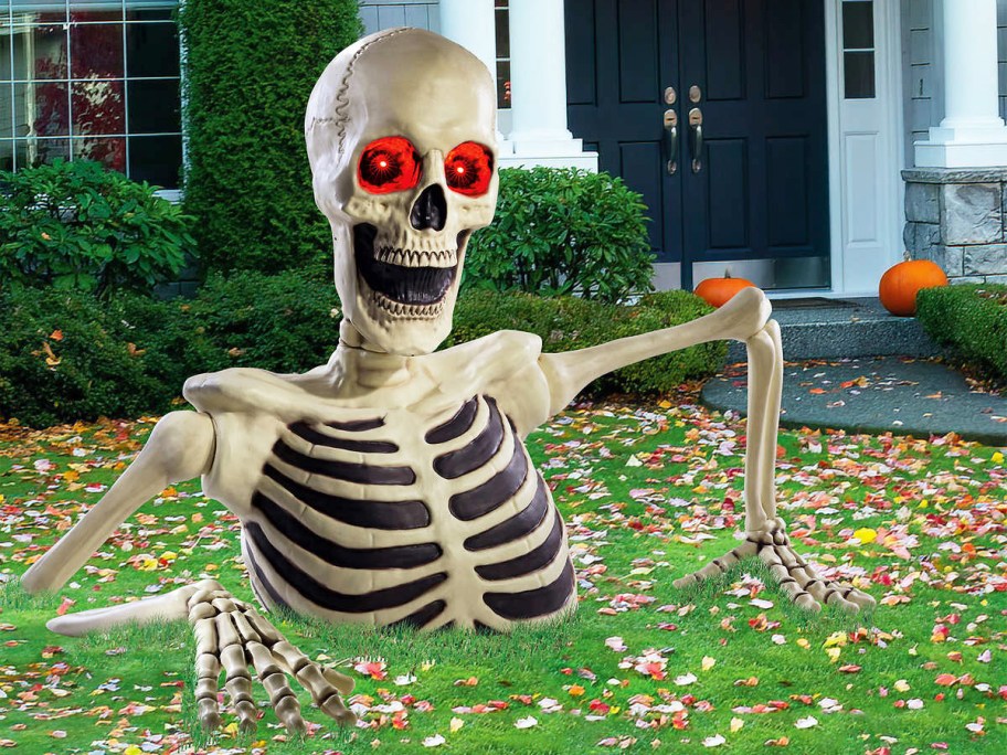 huge skeleton decoration coming up from lawn