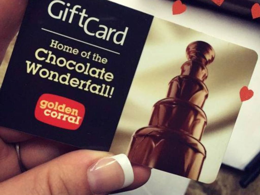 Hand holding a Golden Corral GIft Card