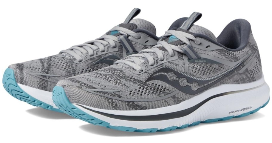 pair of grey, white and light teal women's Saucony shoes