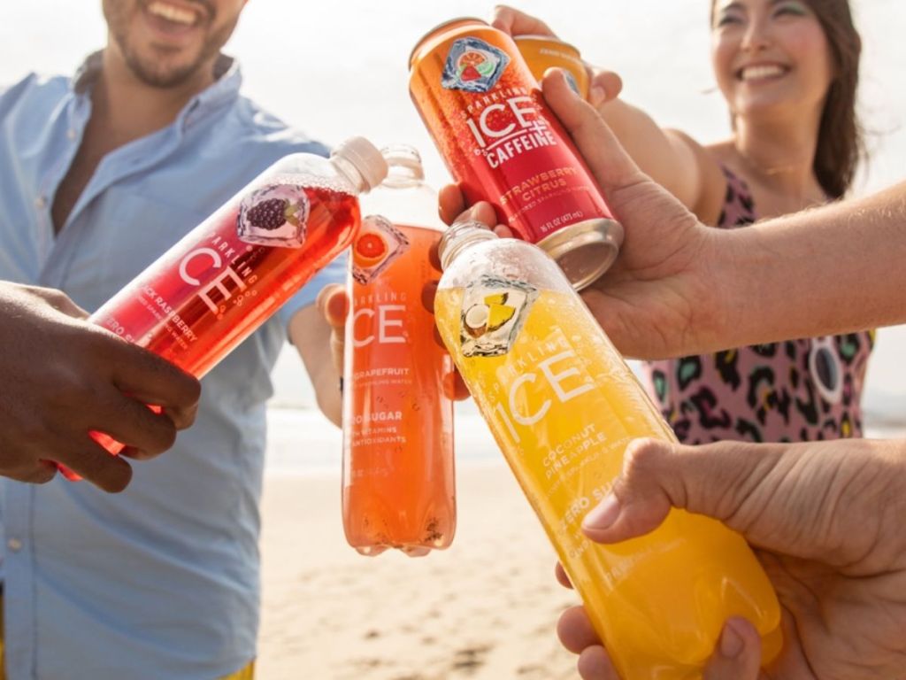 Group of friends enjoying Sparkling Ice drinks on the beach