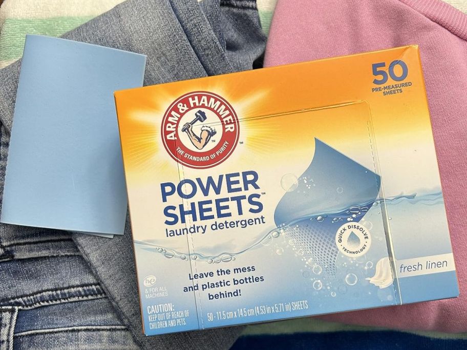 Arm & Hammer Power Sheets Laundry Detergent, Fresh Linen 50ct on basket of laundry