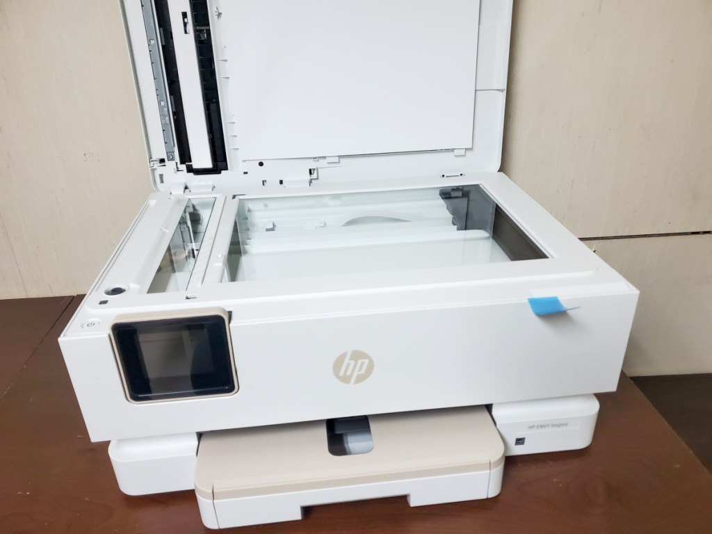 An HP Envy printer on an office desk