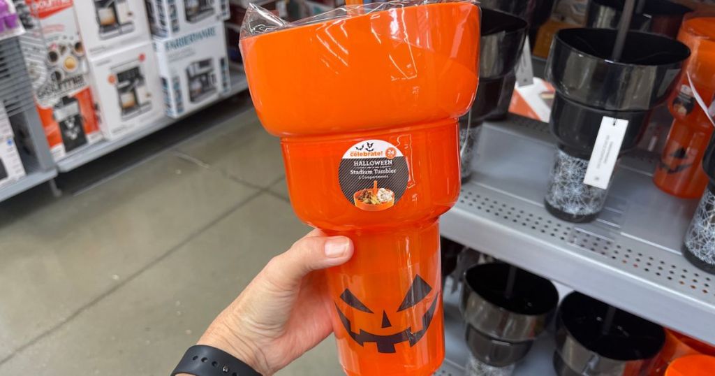 Hand holding a Halloween Stadium cup from walmart